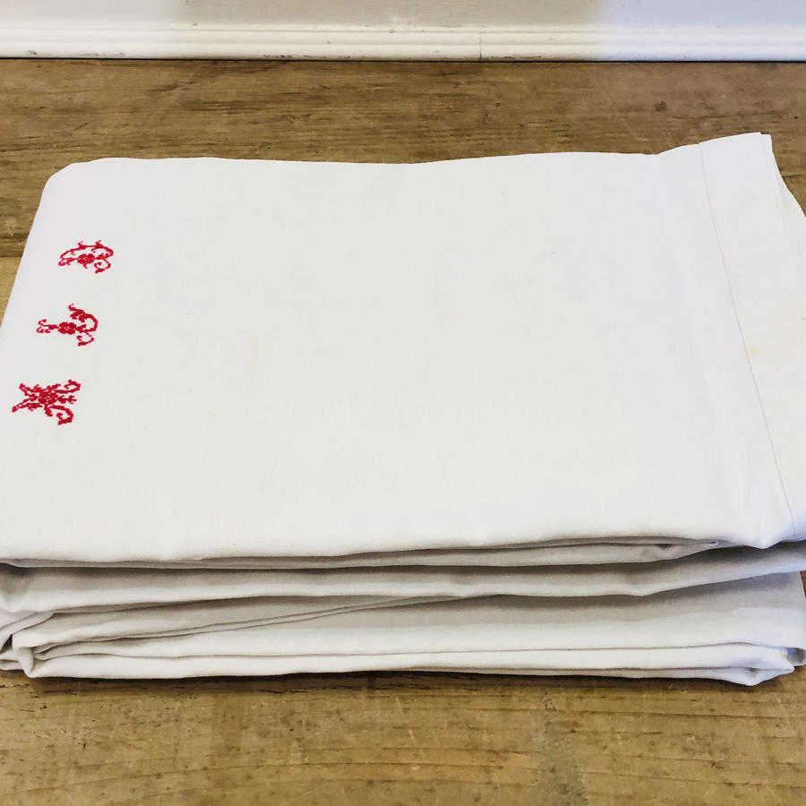 Pair of large French Sheets - red monogram M.L.D.